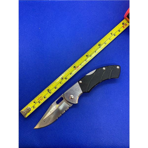 Buck folding pocket knife with clip.