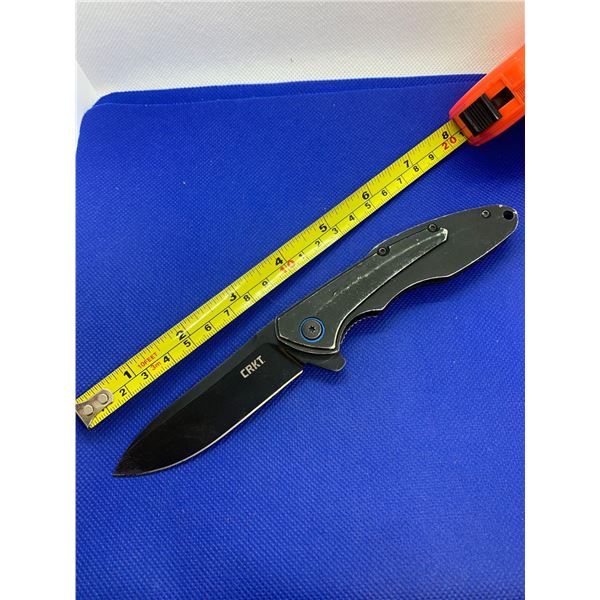 CRKT folding pocket knife with clip.