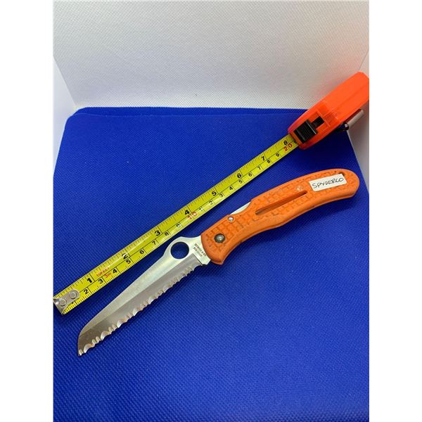 Spyderco folding pocket knife with clip.