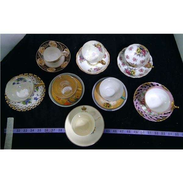 8 Teacups - 2 are 3 Legged