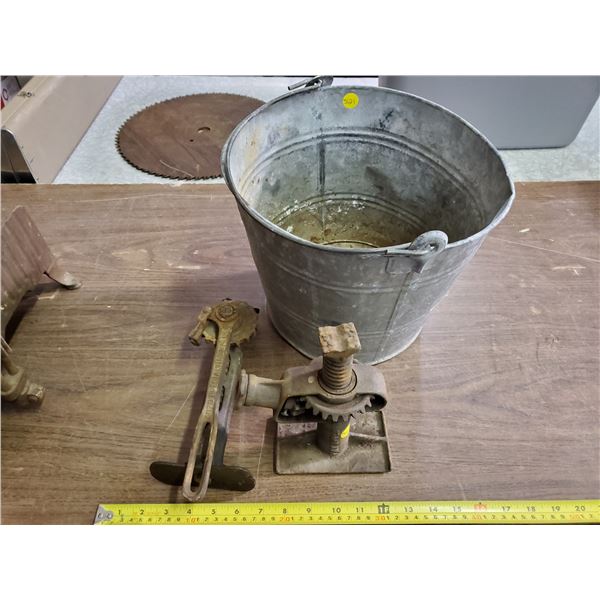 2 IRON JACKS IN GALVANIZED BUCKET