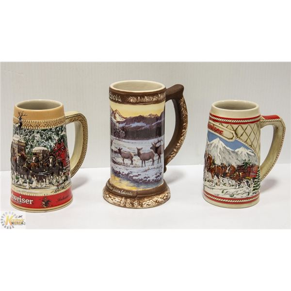 THREE COLLECTIBLE BEER STEINS:  TWO BUDWEISER AND