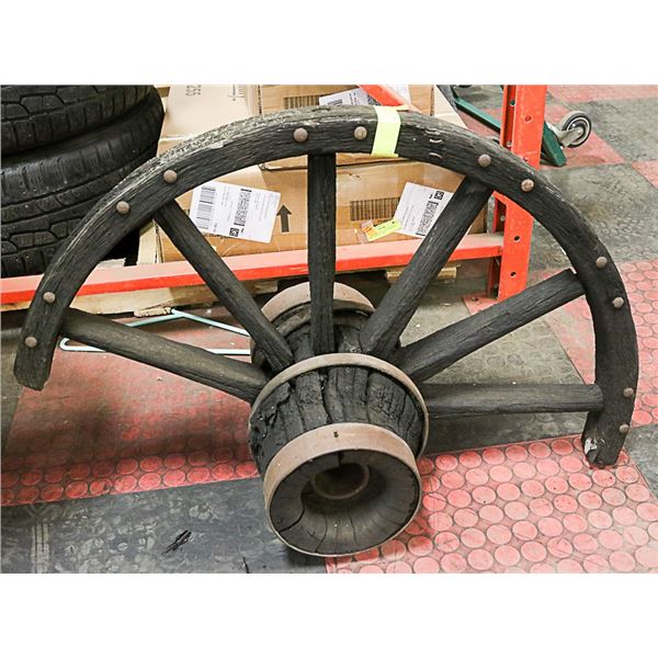 1/2 OF AN ANTIQUE WOODEN WAGON WHEEL