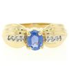 Image 1 : Ribbed 14k Yellow Gold 1.10 ctw Oval Tanzanite Solitaire & Round Diamond Ring