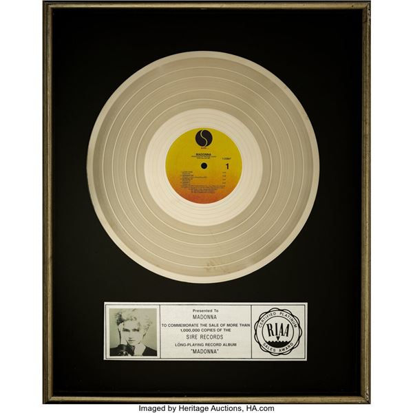 Madonna Presented RIAA Platinum Sales Award For Debut Album. A platinum sales aw