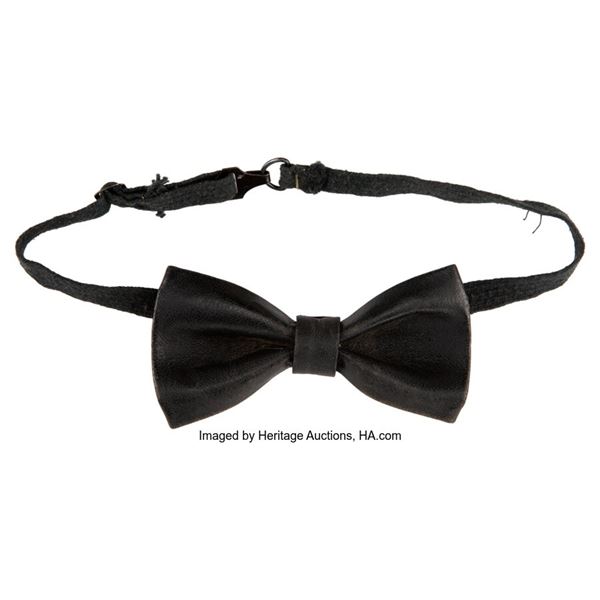 Buddy Holly Stage Worn Bow Tie. A black bow tie worn onstage by the rock legend.
