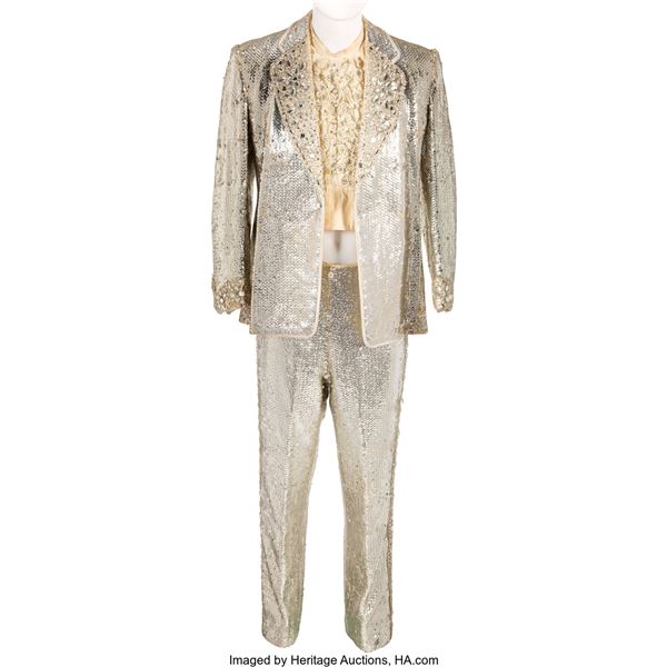 Liberace Worn Suit. A dazzling silver sequin suit and pants from the legendary p