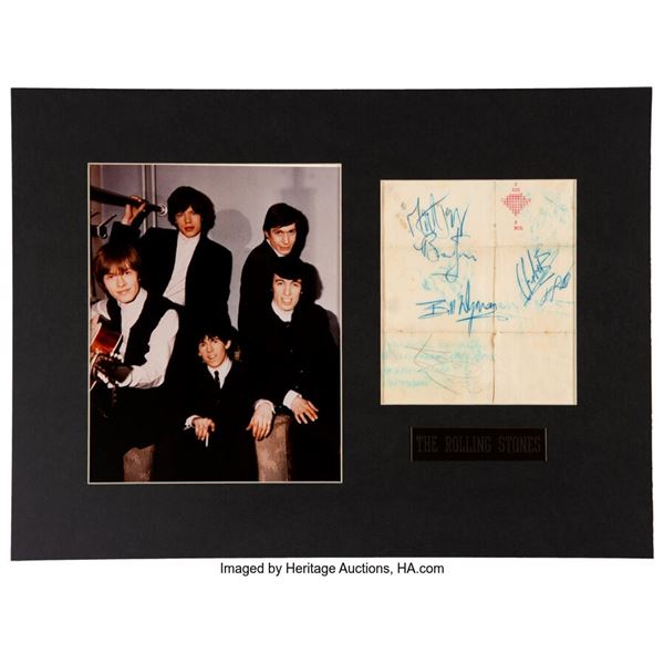 The Rolling Stones Signed Piece of Paper. Matted with a promo photo of the Rolli