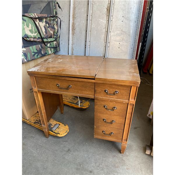 Singer sewing machine in cabinet