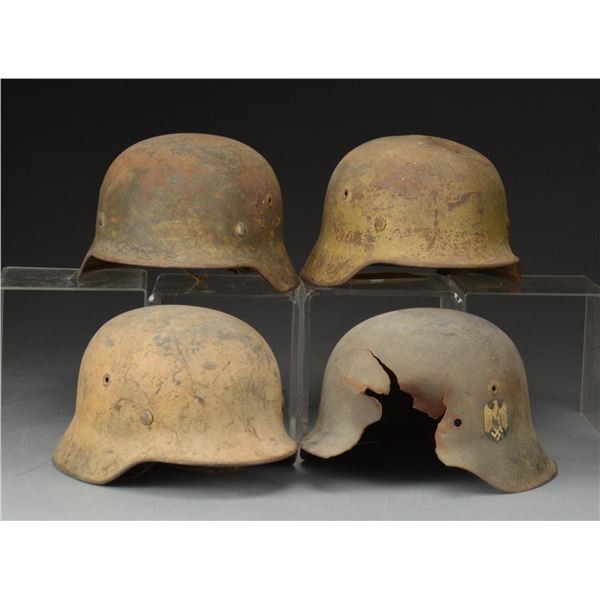 4 WWII GERMAN ARMY HELMETS.