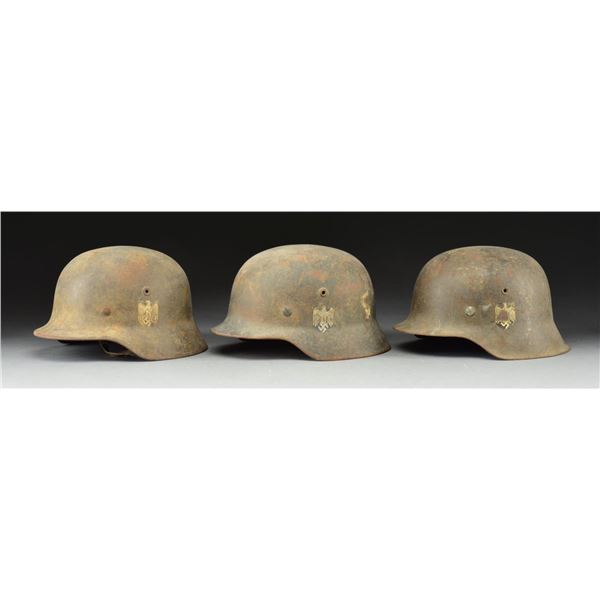 3 WWII HELMETS.