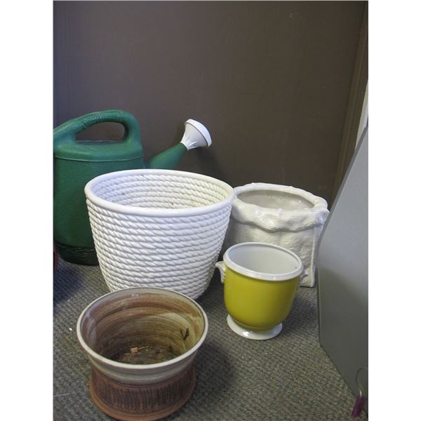 4 Planters and a PLastic Watering Can