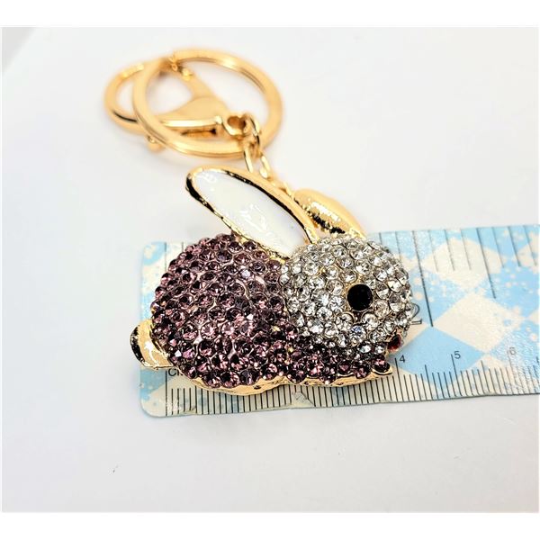 24)  GOLD TONE WITH WHITE & BLACK ENAMEL