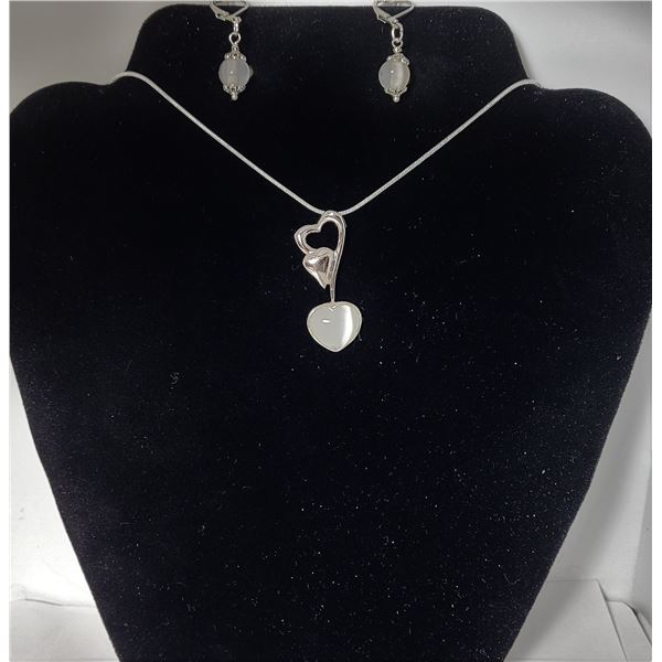 28)  TIBETAN SILVER AND WHITE CAT'S EYE