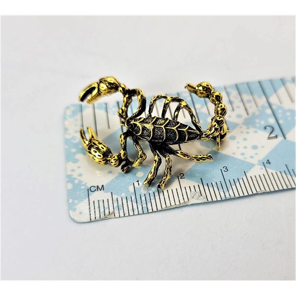 31)  GOLD TONE WITH BLACK ACCENTS SCORPIAN