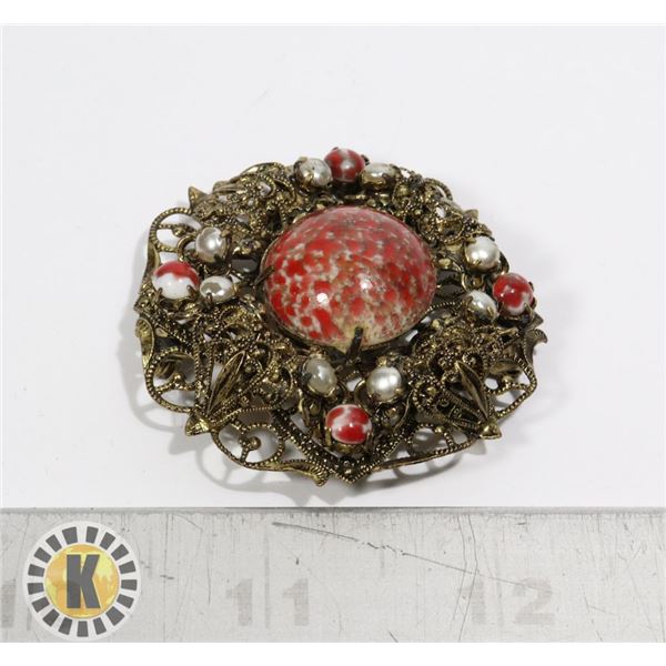 LARGE BALTIC GOLD TONE BROOCH WITH RED STONES