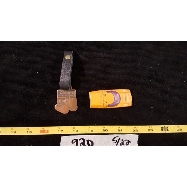 Caterpillar Badge & Matchbox Car
