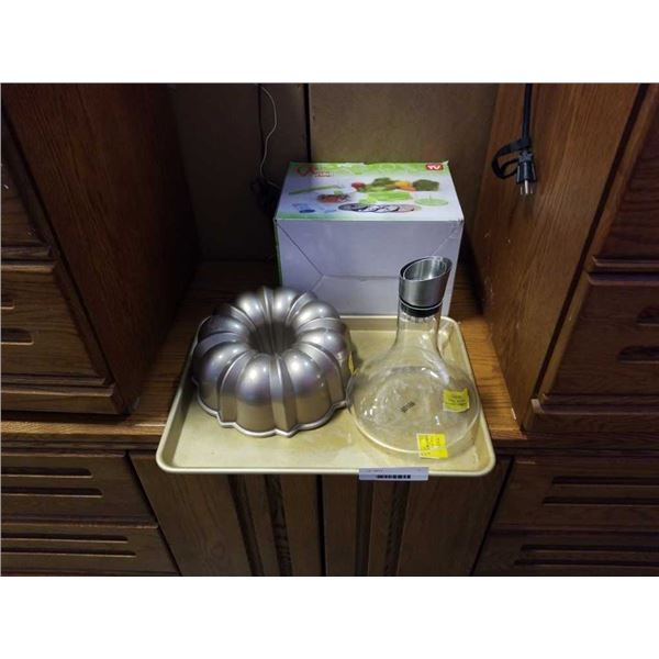 Cookie sheet, wine decanter/aerator, rotochamp and cake pan