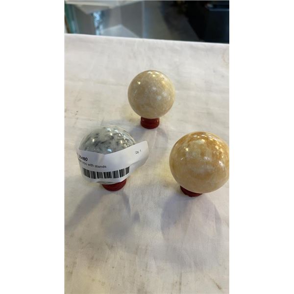 3 marble orbs with stands