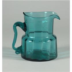 Teal paneled glass pitcher