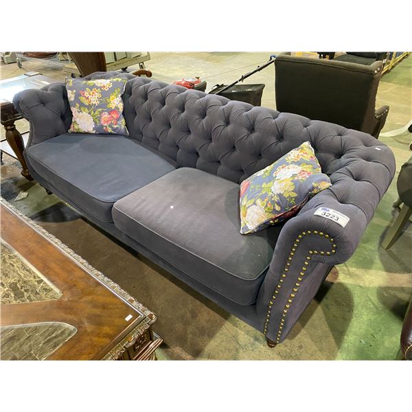 BLUE BUTTON BACK SOFA WITH 2 THROW FLORAL PRINT PILLOWS APPROX. 86" LONG