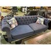 Image 2 : BLUE BUTTON BACK SOFA WITH 2 THROW FLORAL PRINT PILLOWS APPROX. 86" LONG