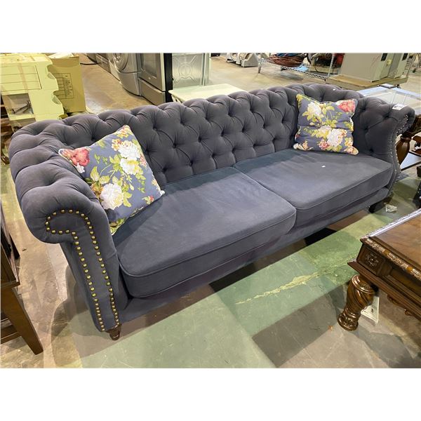 BLUE BUTTON BACK SOFA WITH 2 THROW FLORAL PRINT PILLOWS APPROX. 86" LONG