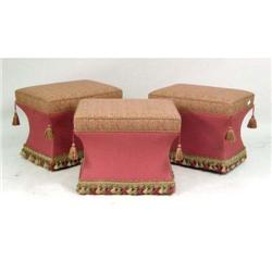THREE RED COTTON PAISLEY UPHOLSTERED STOOLS