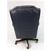 Image 4 : A BLUE LEATHERETTE SWIVELING CLUB CHAIR