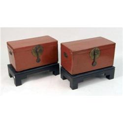 TWO CHINESE RED LACQUER TRUNKS/SIDE TABLES ON STANDS