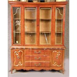 A TWO PIECE GLASS FRONT DISPLAY CABINET