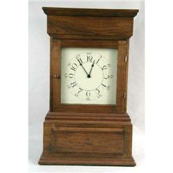 AN OAK SHELF CLOCK