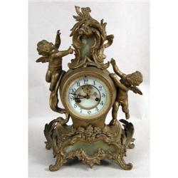 A LOUIS XV STYLE MANTLE CLOCK