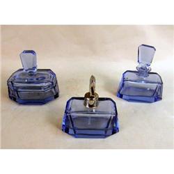 A GROUP OF BLUE COLORED GLASS DRESSER ARTICLES