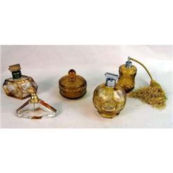 A GROUP OF FIVE AMBER AND COLORLESS GLASS DRESSER ARTICLES