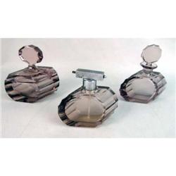 A GROUP OF AMETHYST COLORED GLASS DRESSER ARTICLES