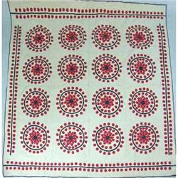 A QUILT WITH AN ADAPTED "SNOWFLAKE" PATTERN