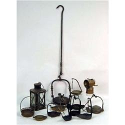 A GROUP OF IRON AND BRONZE LAMPS