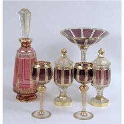 A GROUP OF AMETHYST AND PARCEL-GILT DECORATED GLASS TABLE ARTICLES
