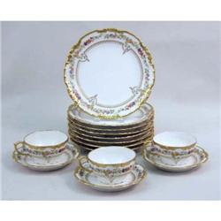 A POLYCHROME PARCEL-GILT DECORATED PORCELAIN DESSERT SERVICE