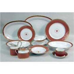 A PARCEL-GILT PORCELAIN DINNER SERVICE