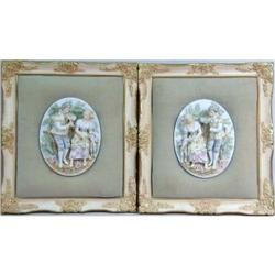 TWO FRAMED POLYCHROME AND PARCEL-GILT DECORATED BAS RELIEF WALL PLAQUES
