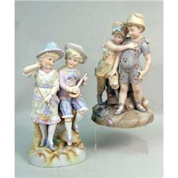 TWO POLYCHROME-DECORATED PORCELAIN FIGURAL GROUPS