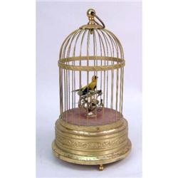 A BRASS MOUNTED AUTOMATION BIRD CAGE