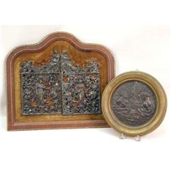 A FRAMED BRONZE PLAQUE