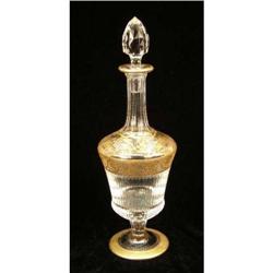 A PARCEL-GILT DECORATED COLORLESS GLASS DECANTER
