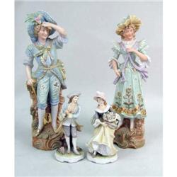 TWO POLYCHROME-DECORATED PORCELAIN FIGURES