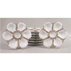 A GROUP OF EIGHT PORCELAIN OYSTER PLATES