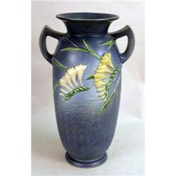A LARGE ROSEVILLE DOUBLE HANDLED CERAMIC URN