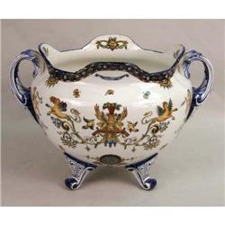 A POLYCHROME-DECORATED SHAPED DOUBLE HANDLED FOOTED PORCELAIN PLANTER